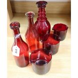 Two ruby glass carafes, three rinses and a decanter