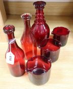 Two ruby glass carafes, three rinses and a decanter