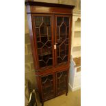 An Edwardian Sheraton revival mahogany and satinwood crossbanded corner display cabinet, on cabriole