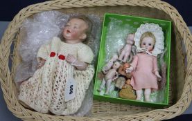 A collection of miniature dolls and an open-mouthed baby bisque headed doll