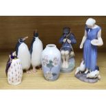 A Bing & Grondahl porcelain figure of a girl, a Royal Copenhagen figures, a pair of penguins, a vase