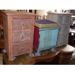 A painted three drawer bedside chest, a six drawer chest and a painted stool