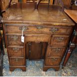 A George I style walnut kneehole desk, W.74cm, D.44cm, H.77cm