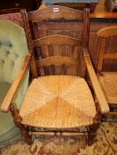 A pair of beech rush seat elbow chairs and a apir of 19th century French fruitwood chairs