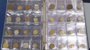 Two albums of world coins and other UK coinage including pennies