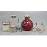 A collection of silver to include scent and toilet bottles, dressing table jars with silver tops,