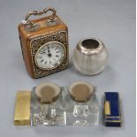 A small American travel clock in leather silver mounted case, two dunhill lighters, a glass