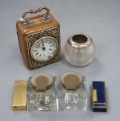 A small American travel clock in leather silver mounted case, two dunhill lighters, a glass