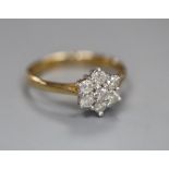 A modern 9ct gold and diamond cluster flower head ring, size J, gross 1.6 grams.