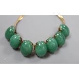 A 14k yellow metal and simulated cabochon jade set bracelet, 18.3cm, gross 33.4 grams.
