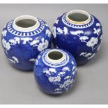 Three Chinese blue and white 'prunus' jars, one with apocryphal kangxi mark