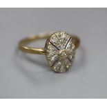 A 9ct gold and diamond chip set oval cluster ring, size M/N, gross 2.1 grams.