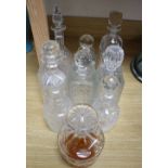Nine various cut and mounted glass decanters and stoppers and two gin labels