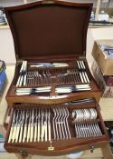 A canteen of cutlery on stand and assorted plated cutlery