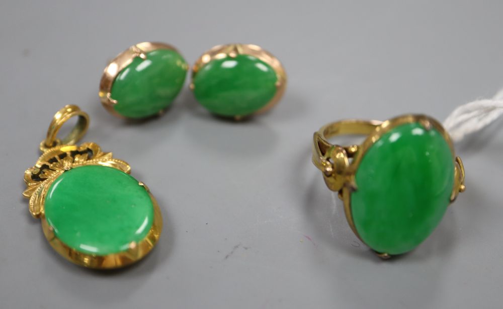 A Chinese yellow metal and jade oval ring, size K, gross 4.2 grams, an 18ct and jade pendant,
