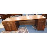 Martino Gamper. A walnut four drawer desk, W.250cm, D.80cm, H.73cm