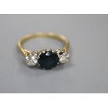 An 18ct and plat, sapphire and diamond three stone ring, size Q, gross 3.4 grams.CONDITION: The