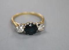 An 18ct and plat, sapphire and diamond three stone ring, size Q, gross 3.4 grams.CONDITION: The