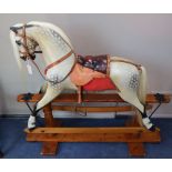 An F.H. Ayres dapple grey rocking horse, L.128cm, H.114cm