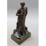 A bronze of a blacksmith, signed, height 22.5cm