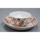 A Chinese famille rose tea bowl and saucer