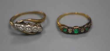 A 19ct century yellow metal emerald and rose cut diamond set half hoop ring, size L/M, gross 1.7