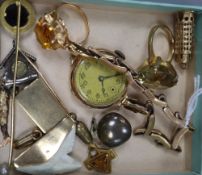 Mixed jewellery including two rings, one 9ct gold, a 9ct watch on 9ct strap, six assorted charms