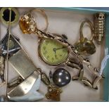 Mixed jewellery including two rings, one 9ct gold, a 9ct watch on 9ct strap, six assorted charms