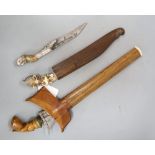 Two Ceylonese knives Pia Kaetta, both with ivory grips and silver mounts and a Malayan dagger