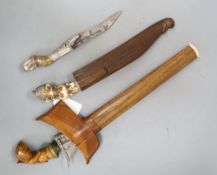 Two Ceylonese knives Pia Kaetta, both with ivory grips and silver mounts and a Malayan dagger