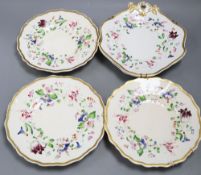 A set of three Staffordshire porcelain plates, gilt and painted with flowers and a matching pair