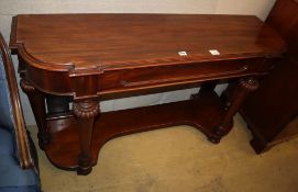 A Victorian mahogany side table, moulded frieze drawer, on bun feet with brass and porcelain