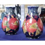 A pair of Moorcroft pomegranate vases, height 16cm