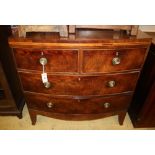 A Regency mahogany bow-fronted chest fitted two short drawers and two long drawers, on tapered feet,