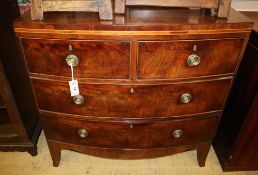 A Regency mahogany bow-fronted chest fitted two short drawers and two long drawers, on tapered feet,