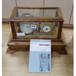 An Edwardian Art Nouveau barograph, inlaid with ebony, brass and copper, possibly Glasgow School,