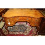 A walnut serpentine front dressing table, Width 107cm