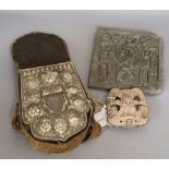 A Tibetan Ghau prayer box, white metal-mounted with inset figure of Buddha, in silk carrying case