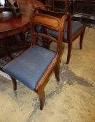 A set of six Regency brass inlaid mahogany dining chairs