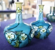 A pair of Minton's Secessionist small bottle vases, height 11cm