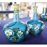 A pair of Minton's Secessionist small bottle vases, height 11cm