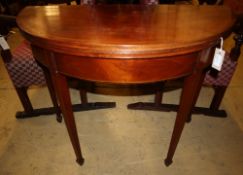 A George III inlaid mahogany demi-lune tea table with folding top