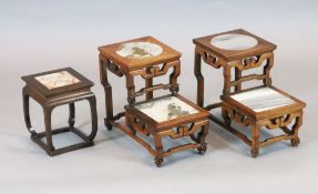 A pair of Chinese hardwood two tier vase stands, inset with marble panels, width 32.5cm, depth 19cm,