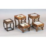 A pair of Chinese hardwood two tier vase stands, inset with marble panels, width 32.5cm, depth 19cm,