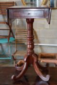 A mahogany occasional table with drop leaves on stand, width 39cm, depth 53cm, height 73cm