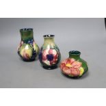 Three Moorcroft small vases, tallest 12cm