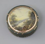 An early 19th century French bois durci snuff box, with gold inlaid decoration, the lid inset with a