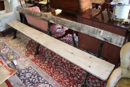 A large Victorian cast iron and wood slat garden bench, length 305cm, depth approx. 55cm, height