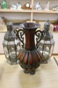 A pair of pierced octagonal lanterns, height 53cm and a metalware vase