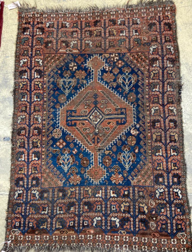 A Caucasian blue ground rug, 128 x 89cm, a Persian style red ground mat and a gold ground rug - Image 2 of 4